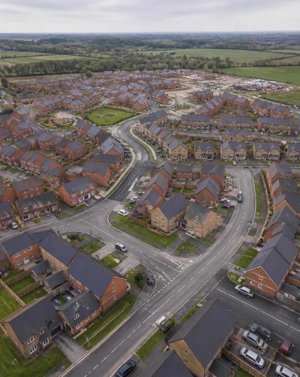 Aerial view of a large UK residential development with completed roads and drainage